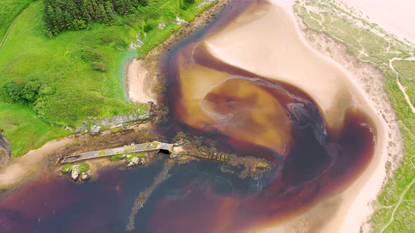 Aerial of the Mouth of the Fintragh River at Fintra Beach By Killybegs County Donegal Ireland