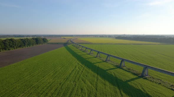 Aerial View Of Transrapid Test Track On Lush Green Field In Lathen, Germany. drone shot