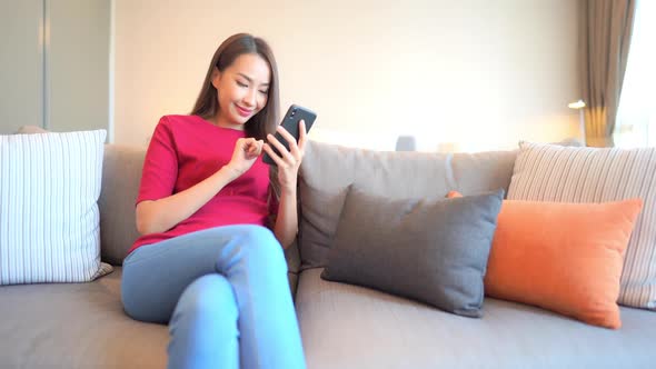 Young asian woman use smart phone