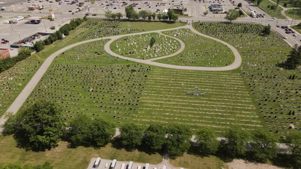 Aerial flyover rural Cemetery beside parking area in Welland,Canada