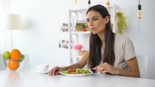 Woman Eating Salad, Feeling Tooth Ache From Excess Acid in Products, Health