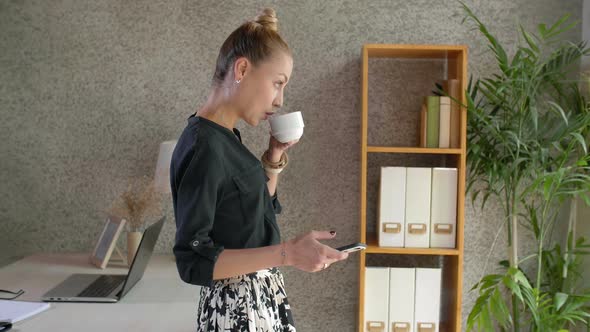 Businesswoman Having Coffee Break