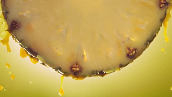 Flowing Pineapple Juice From Pineapple Slice Macro Shot in Slow Motion