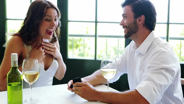 Man offering engagement ring to woman 4k