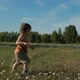 Slow Motion of a Small Child Running Through the Park - VideoHive Item for Sale