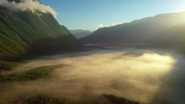 Morning Mist Over the Valley Among the Mountains in the Sunlight