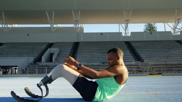 Disabled athletic exercising on a running track 4k