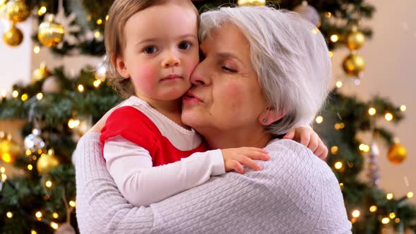 Grandmother and Baby Girl Hugging on Christmas