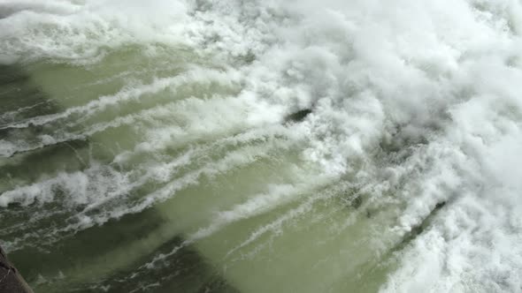 Water Flowing From Hydroelectric Dam Into River