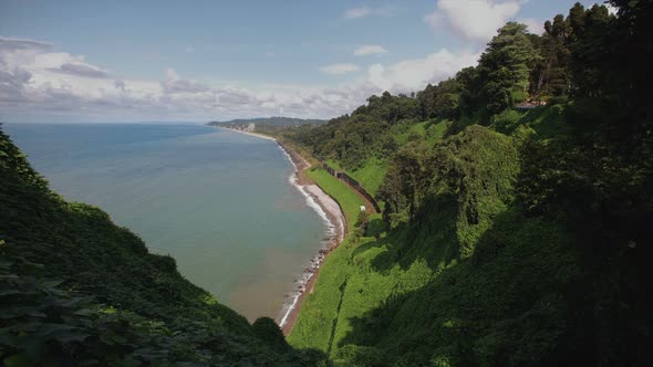 Mountains with Tropical Trees Bushes, Cliff To Beach Railway Tracks and Tunnel Botanical Garden