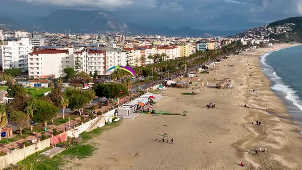 Aerial view 4 K parachute jumper flying over beautiful Alanya