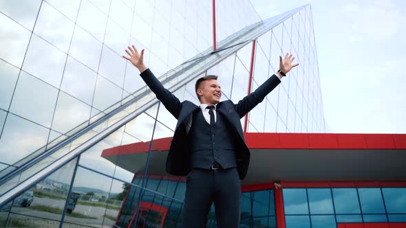 Happy Overjoyed Caucasian Businessman Celebrate Good News Surprise at at Work with Modern Office