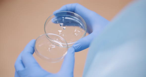 Scientist Examining Basteries Samples in Tubes at Laboratory.