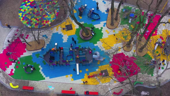 Children's Colourful Outside Playground with Carousels Swings and Slides