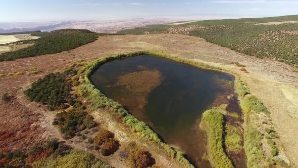 Flying over pond along the LaSal Loop Road near Moab Utah.