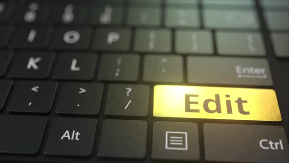 Black Computer Keyboard and Gold Edit Key