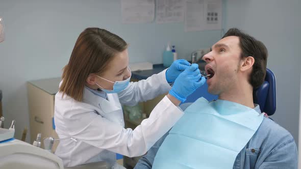 Dentist Cheering Patient Before Check-up in Office