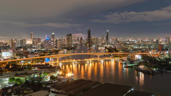 Time lapse of aerial view of Taksin Bridge with Chao Phraya River, Bangkok