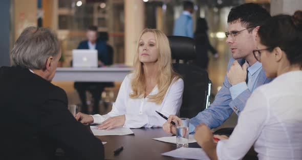 Business Lady Shaking Hands with Entrepreneur During Meeting in Office