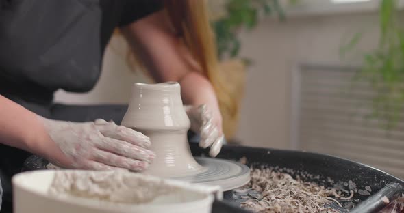 Closeup of the Hand of a Master Potter Working on a Potter's Wheel