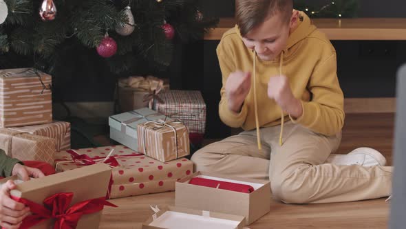 Boy Opening Present Box on Christmas