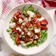 Tasty Dried Tomatoes Salad with Fresh Vegetables Mix and Mozzarella Cheese Served with Toasts - VideoHive Item for Sale