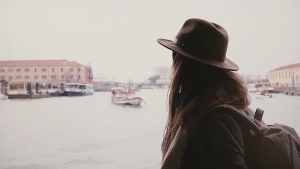 Peaceful Young Attractive Female Tourist on Beautiful Boat Excursion Tour Along Busy City River