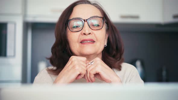 Portrait of a Senior Mature Woman Making a Video Call with Family or Friends