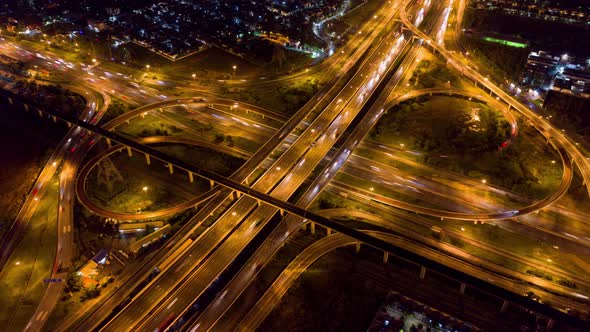 Hyperlapse of aerial view of highway junctions. Urban city, Bangkok at night, Thailand.