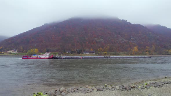 Cargo Pusher Boat on a River Transporting Cargo and Goods