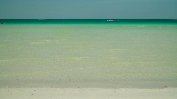 Tropical Sandy Beach and Blue Sea, Philippines.