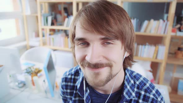 Portrait of a Modern Creative Person with Headphones, He Enjoys Music