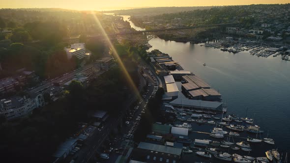 City Waterfront Canal Bridges Helicopter Angle At Sunset alt