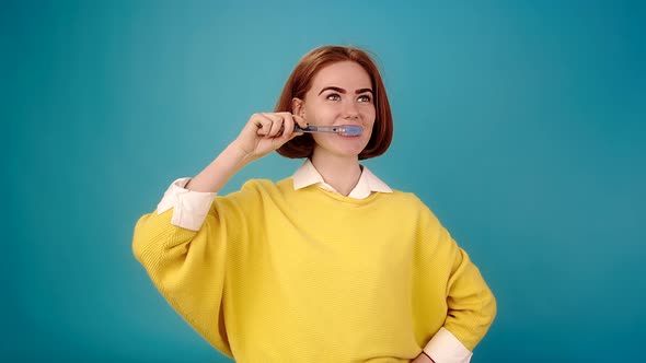 Smiling Model Brushes Teeth