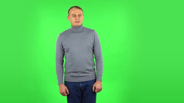 Male Standing Worrying in Expectation Then Sighs with Relief. Green Screen