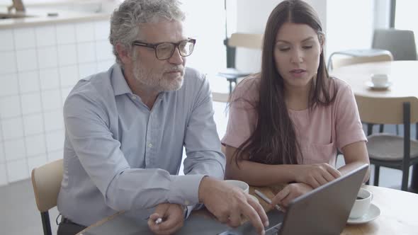 Beautiful Brunette Female Colleague Talking with CEO