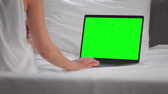 Womam Using Chroma Key Laptop