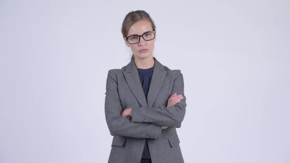 Young Stressed Businesswoman Looking Angry with Arms Crossed