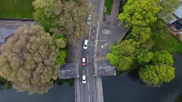 Top down perspective following traffic across iconic english landscape in the form of an old victori