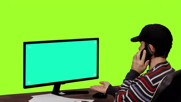 Computer Engineer Looking at Mockup Green Screen