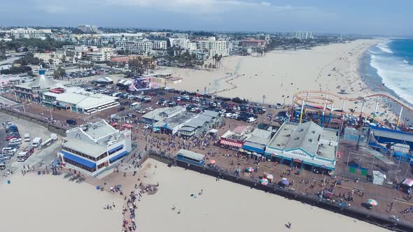 SANTA MONICA, CA - AUGUST 2017: Aerial View of Famous Santa Monica Pier with Turists Having Fun