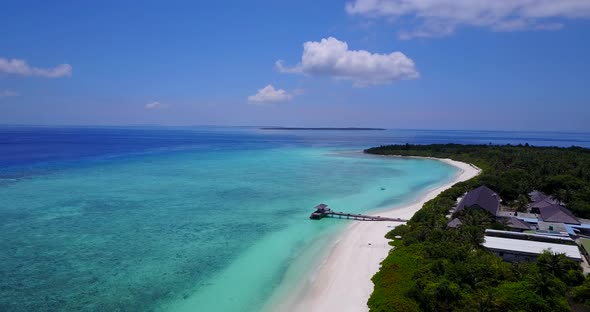 Beautiful above island view of a summer white paradise sand beach and blue sea background in colourf