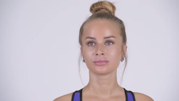 Face of Young Beautiful Blonde Woman Thinking Ready for Gym