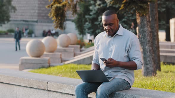 Focused Senior Black Businessman Sitting Outdoor Using Laptop African American Mature Male