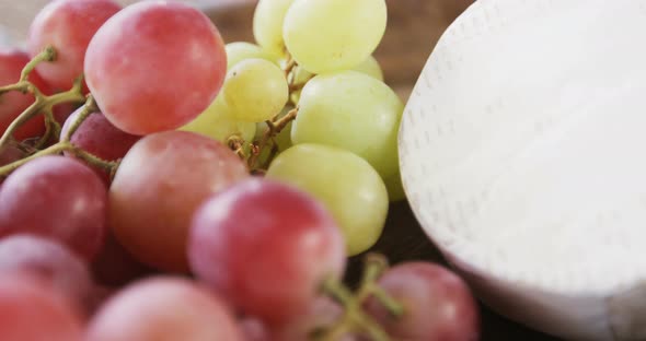 Cheese with olives, walnuts and grapes