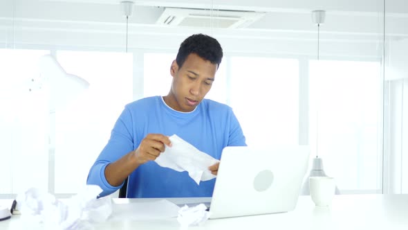 Found Answer, Afro-American Man Working on Documents