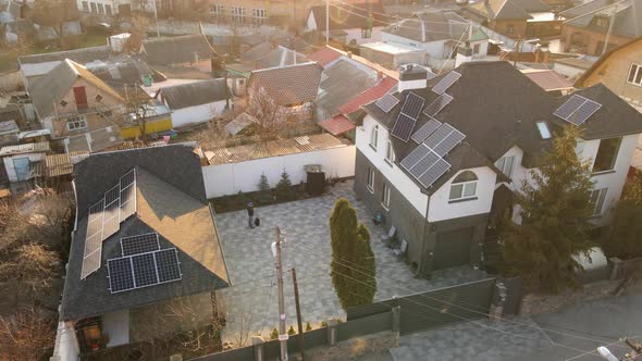 Aerial Drone Shot of Photovoltaic Solar Panels on the Roof of a Building for Renewable Energy