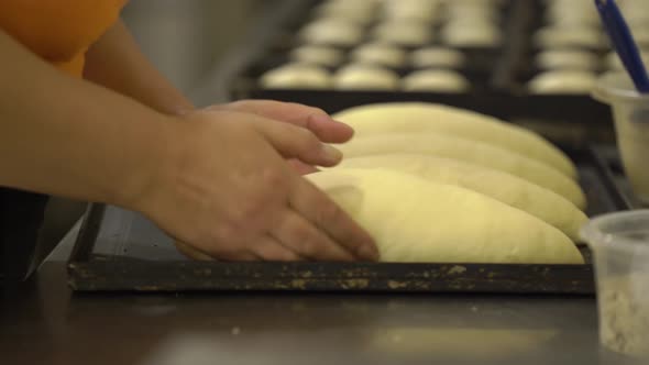 Baker's hands make bread․ Baking bakery. Bread industry.