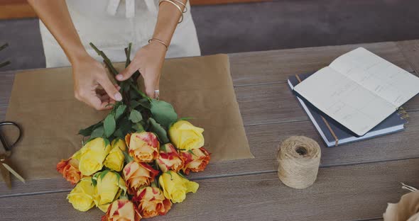 Florist preparing flower bouquet