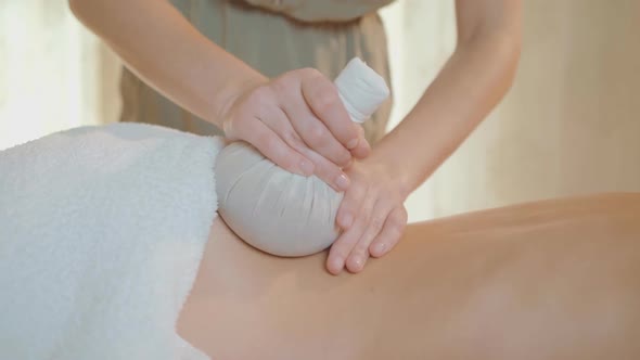 Thai massage. Massage for health. Woman having massage in spa salon. Back massage.